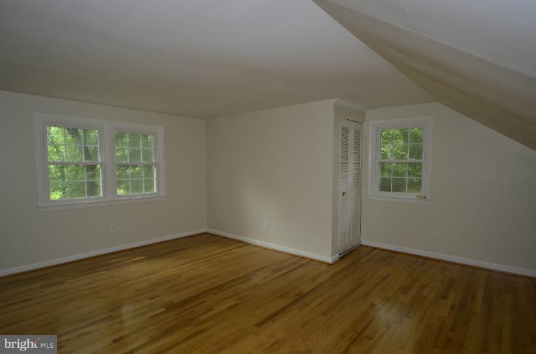 2306 Short Ridge Road Reston, VA 20191 - Photo 15 of 21 The master bedroom has 3 windows overlooking trees