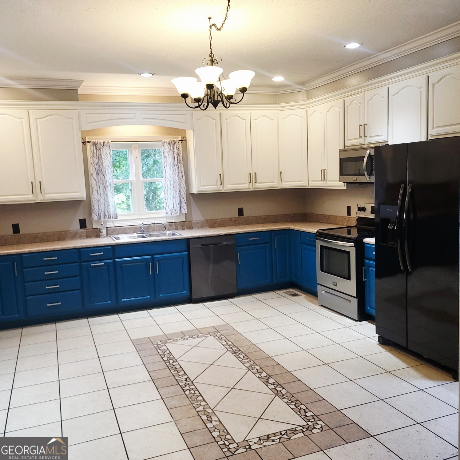 2012 29th Boulevard Valley, AL 36854 - Photo 13 of 29 a kitchen with stainless steel appliances granite countertop a sink counter space cabinets and a window