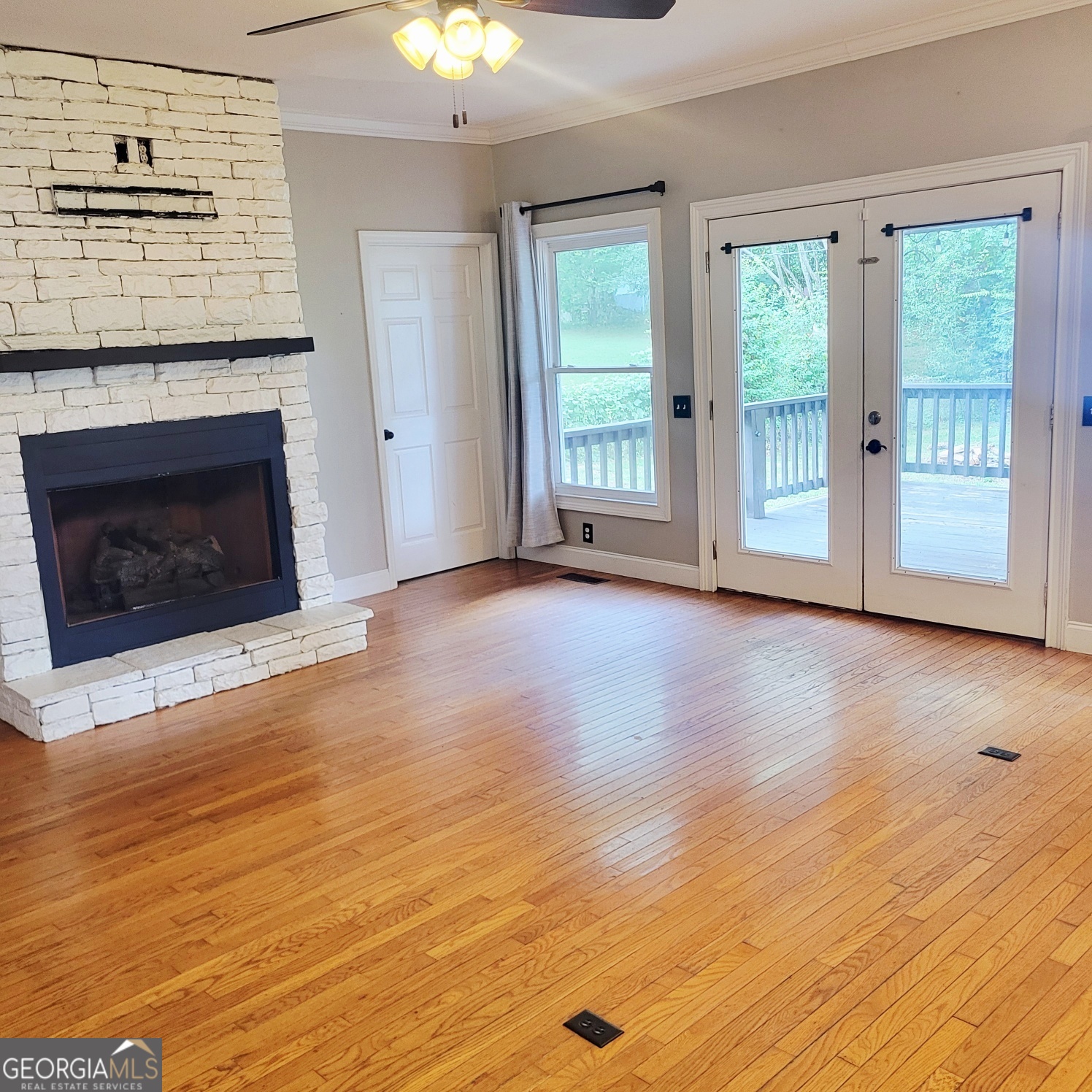 2012 29th Boulevard Valley, AL 36854 - Photo 14 of 29 a view of a livingroom with wooden floor and a fireplace