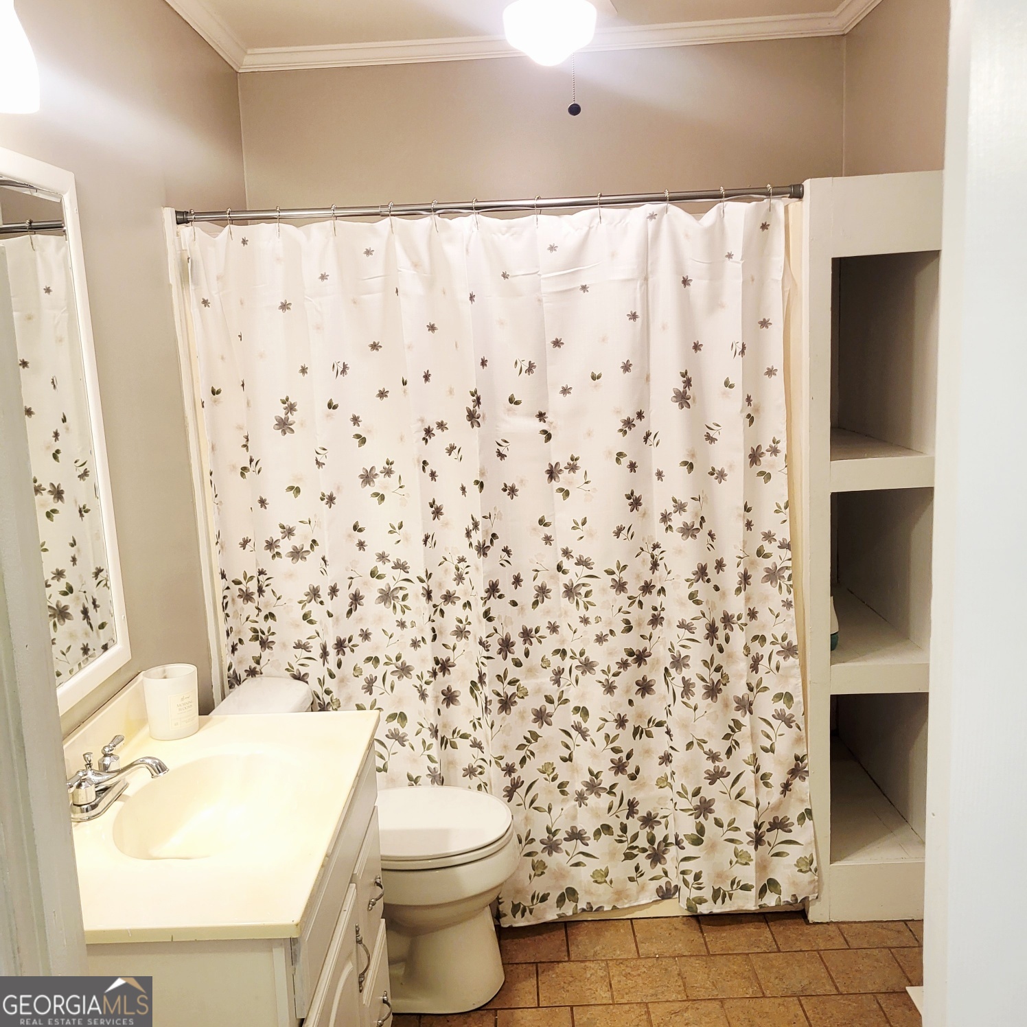 2012 29th Boulevard Valley, AL 36854 - Photo 10 of 29 a bathroom with a toilet and a shower curtain