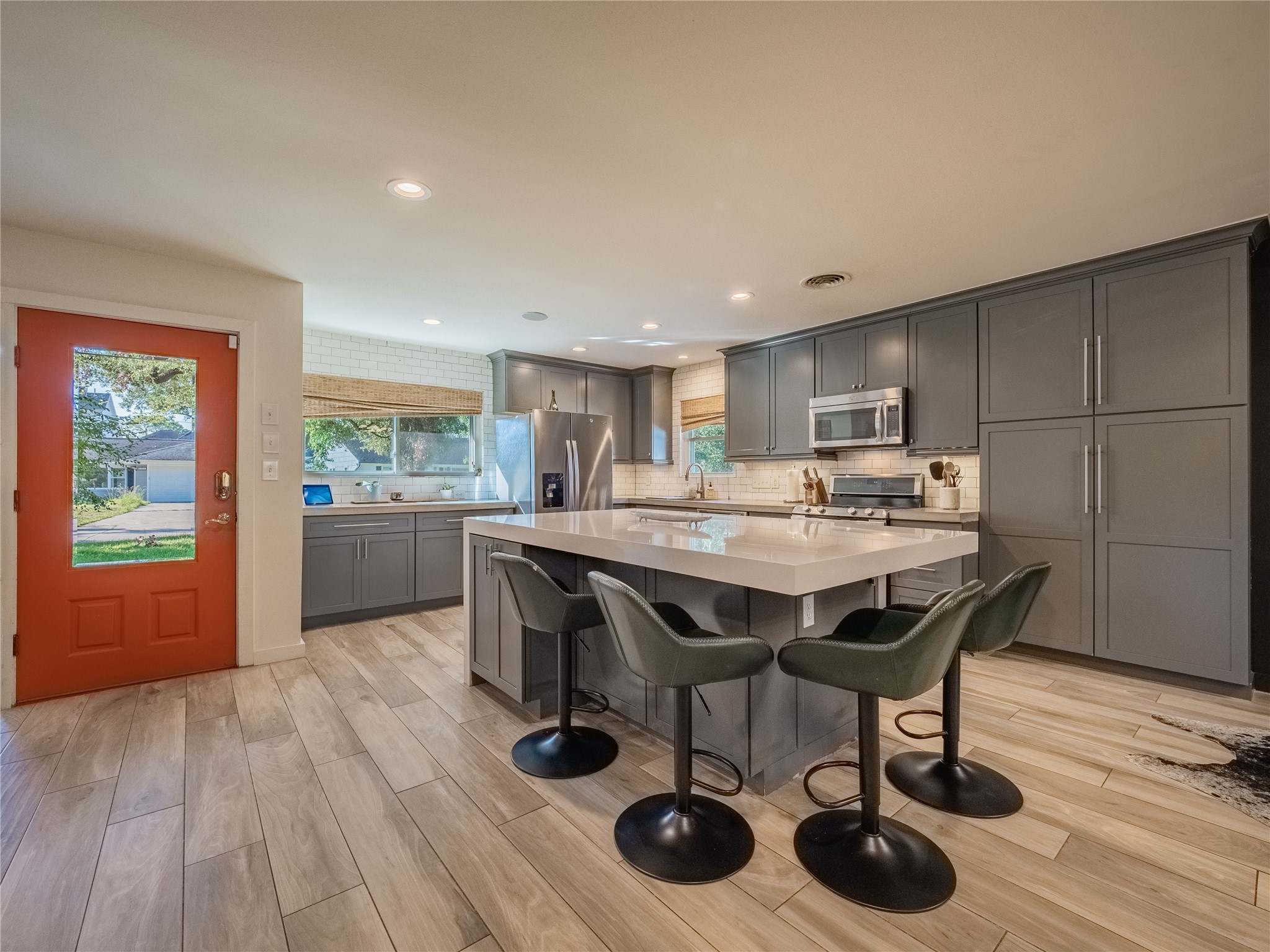 3010 Conway Street Houston, TX 77025 - Photo 9 of 21 a kitchen with a table and chairs in it