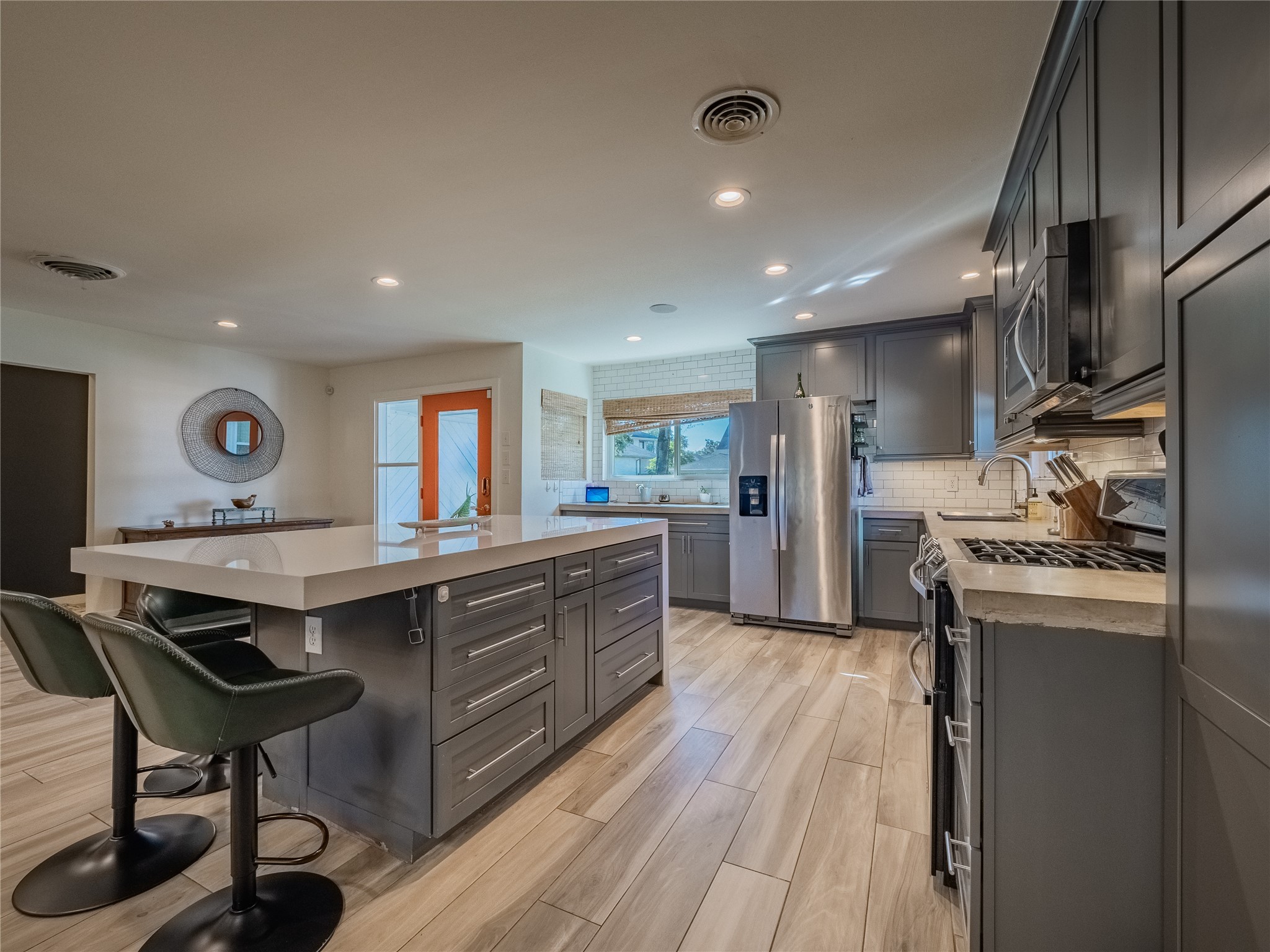 3010 Conway Street Houston, TX 77025 - Photo 10 of 21 a kitchen with stainless steel appliances granite countertop a stove refrigerator and cabinets