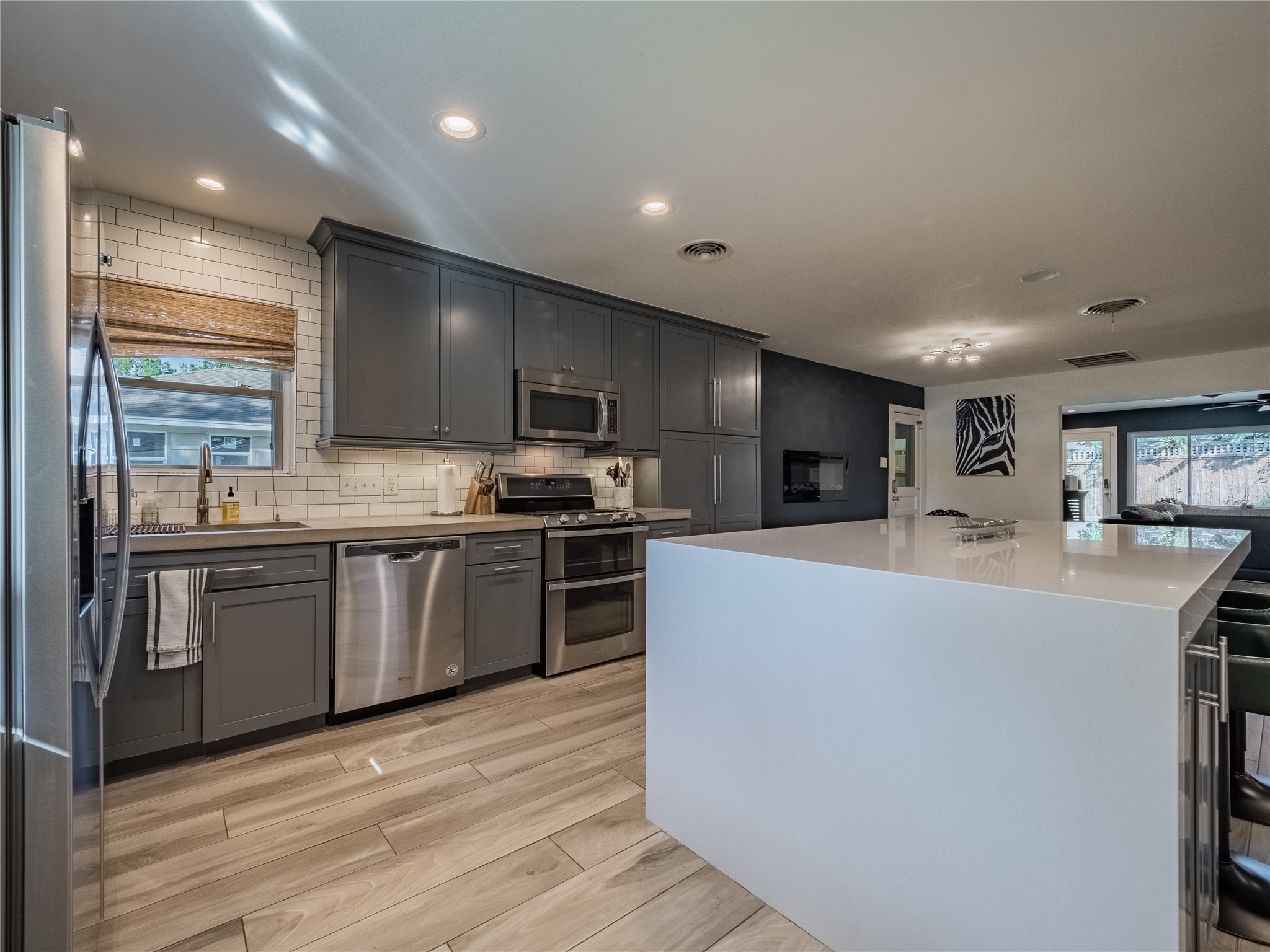 3010 Conway Street Houston, TX 77025 - Photo 12 of 21 a kitchen with stainless steel appliances granite countertop a refrigerator sink and stove