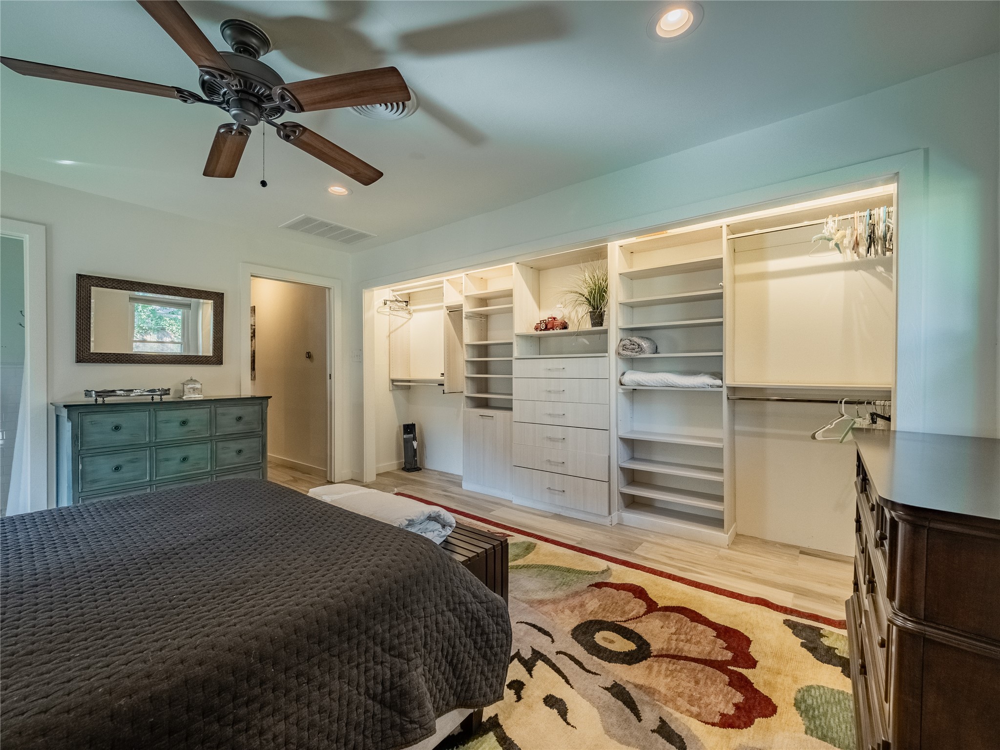 3010 Conway Street Houston, TX 77025 - Photo 15 of 21 a bedroom with a bed and a walk in closet