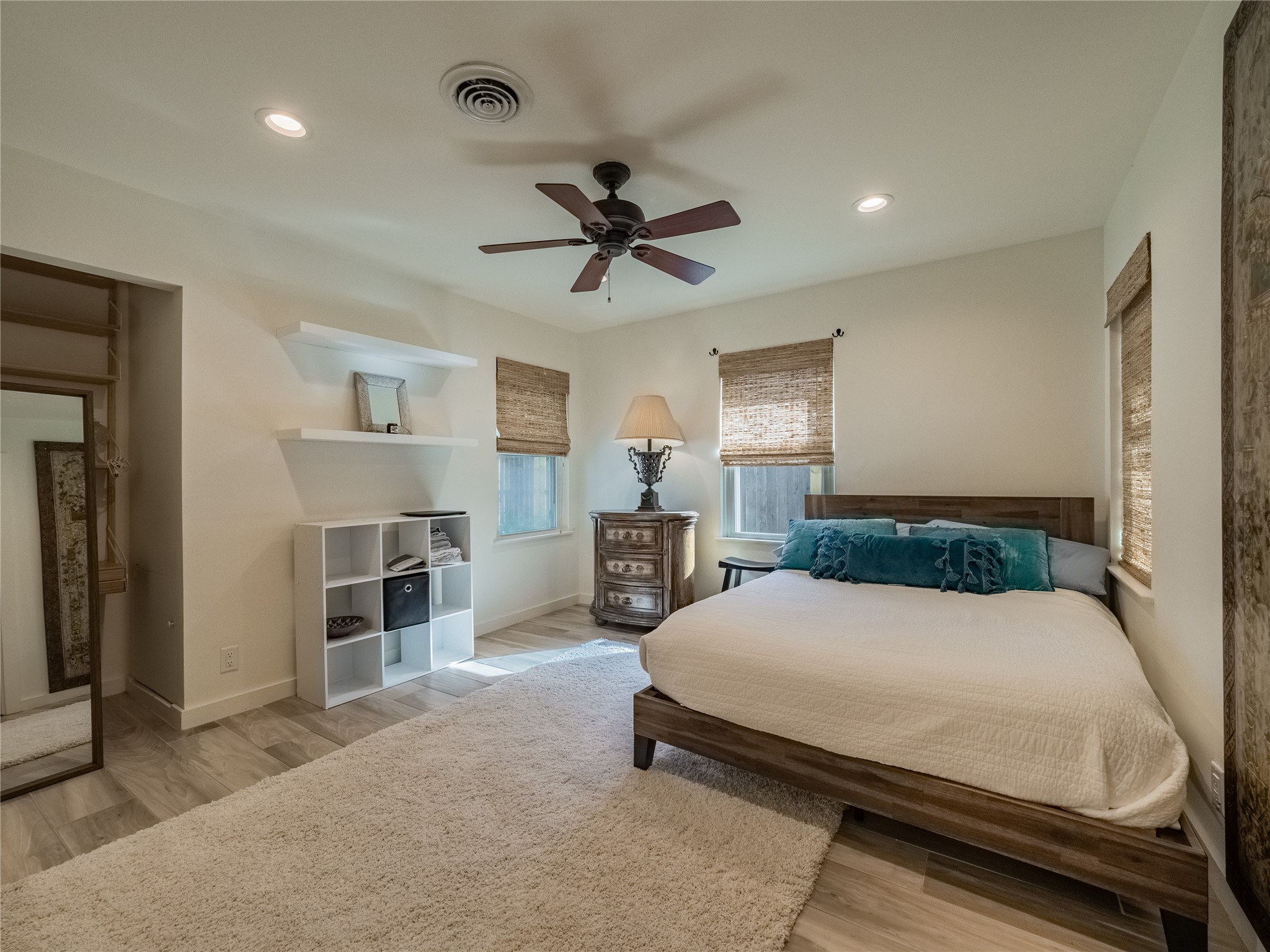 3010 Conway Street Houston, TX 77025 - Photo 17 of 21 a bedroom with a bed and a chandelier