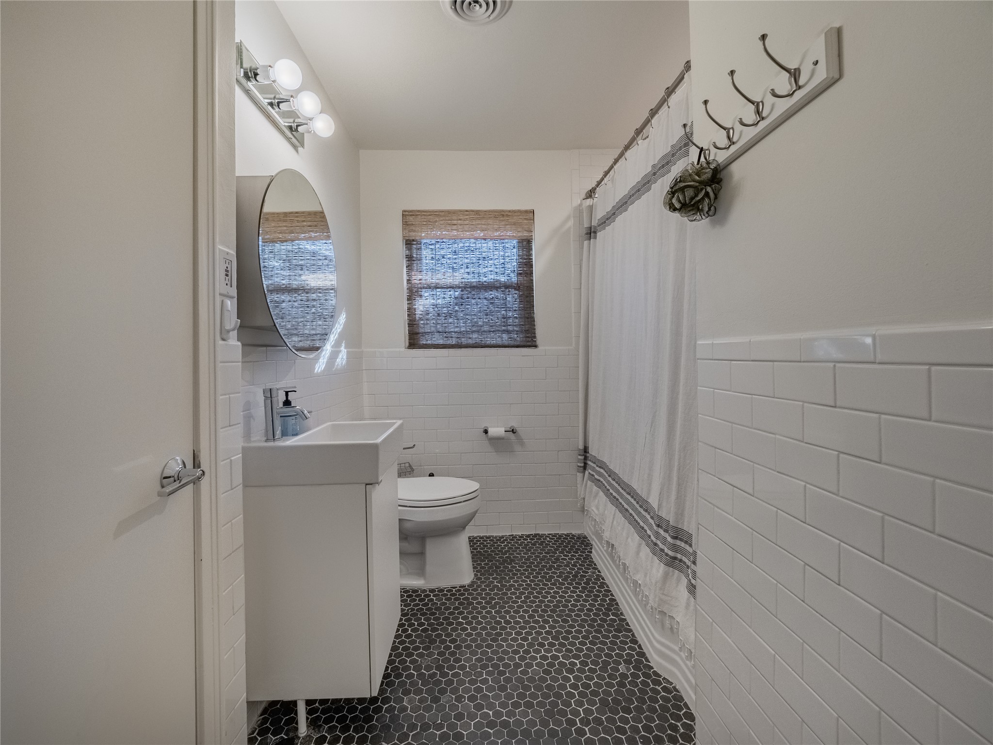 3010 Conway Street Houston, TX 77025 - Photo 19 of 21 a bathroom with a toilet and a shower