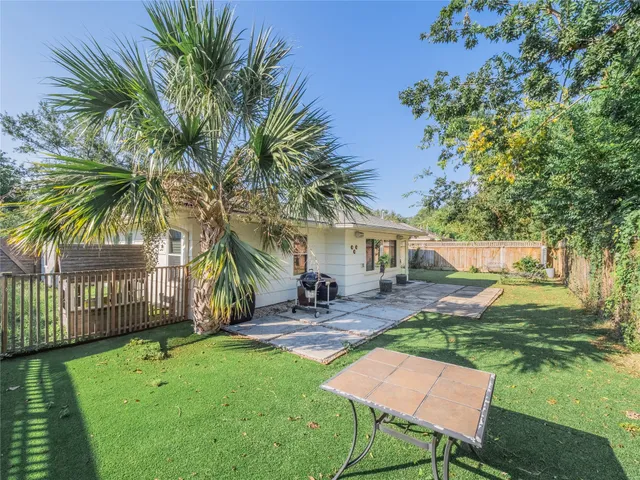 a view of a backyard with a sitting area