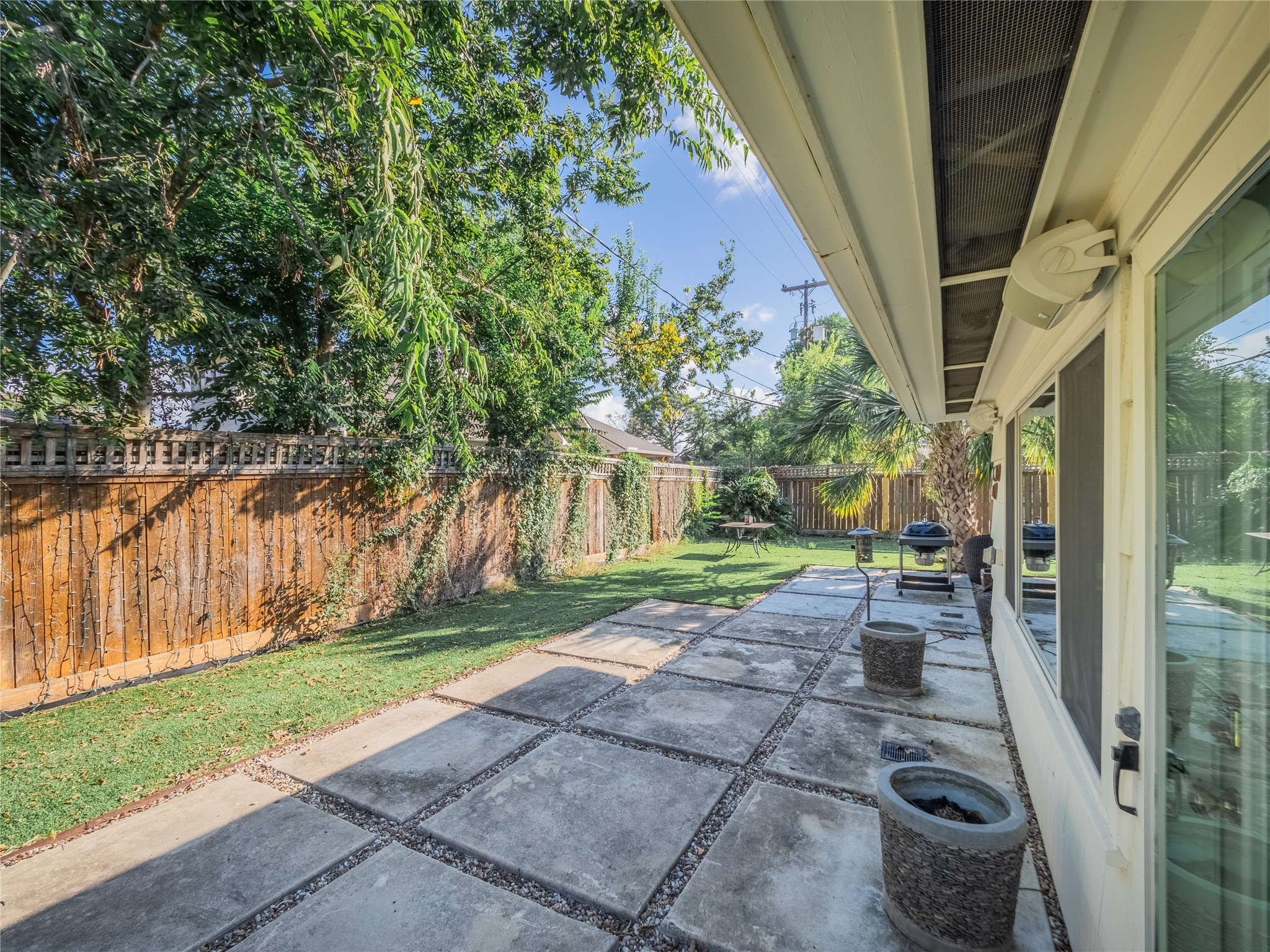 3010 Conway Street Houston, TX 77025 - Photo 5 of 21 a view of a porch with couches and table and chairs next to yard