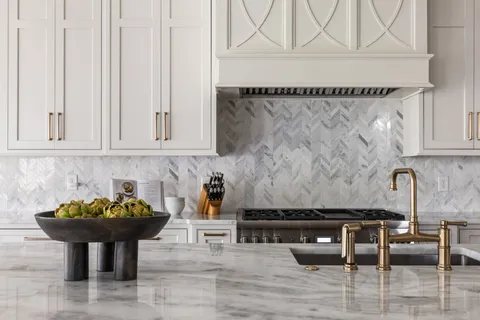 a kitchen with a sink and cabinets