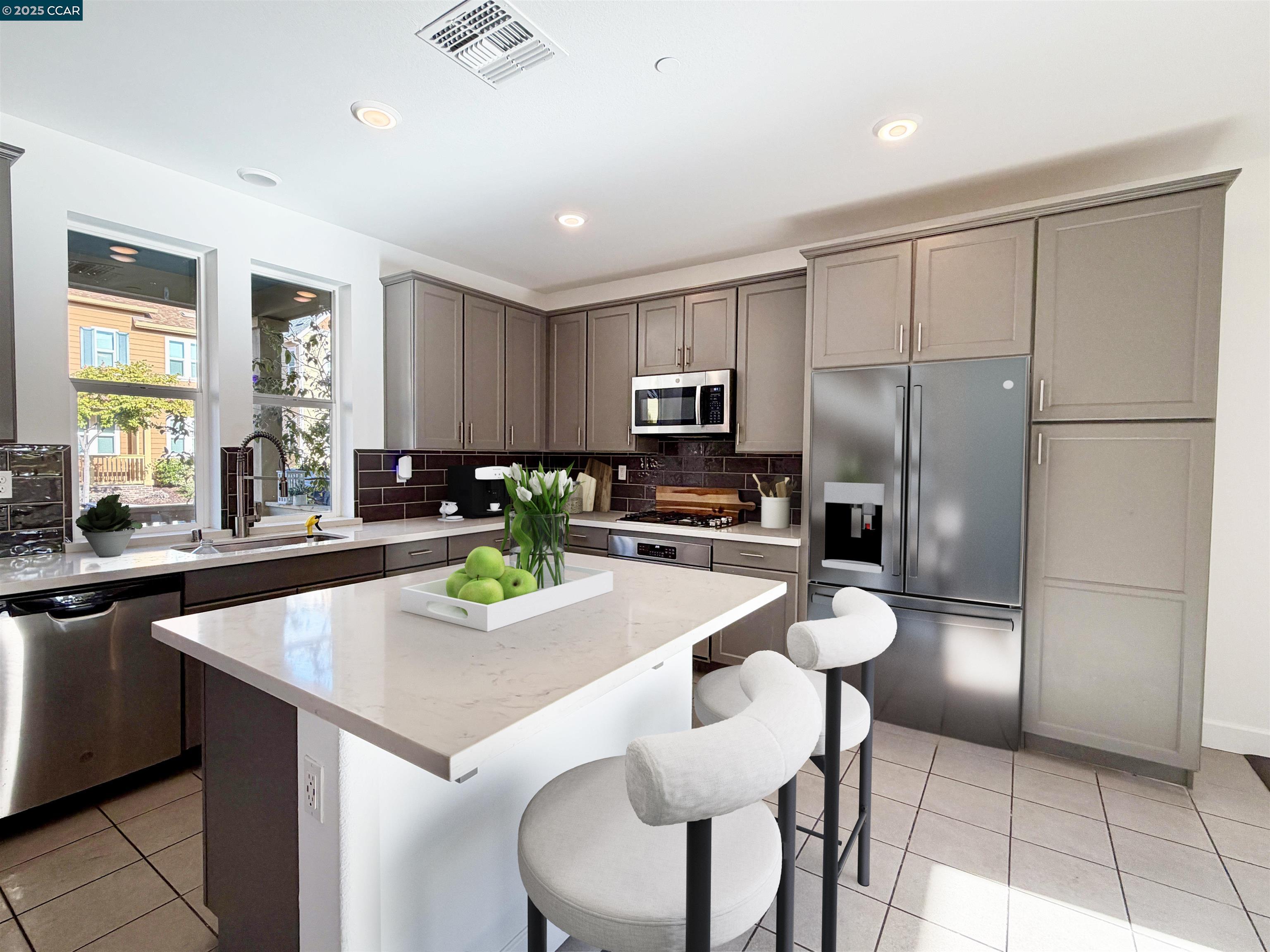 1861 Shasta Lane Hercules, CA 94547 - Photo 15 of 22 a kitchen with granite countertop stainless steel appliances a refrigerator a sink a stove a table and chairs