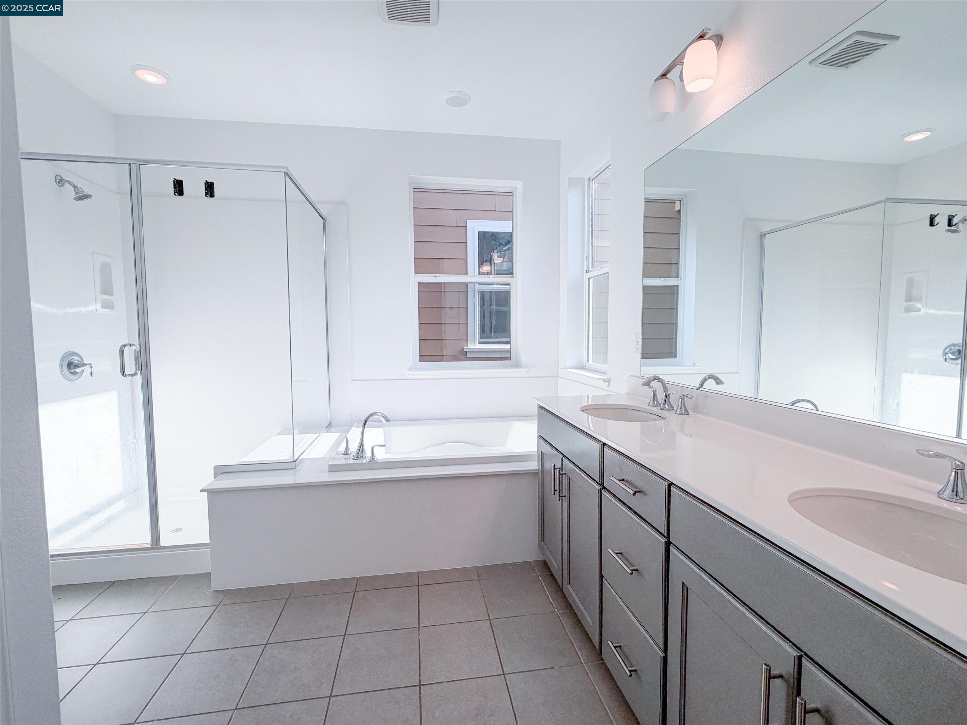 1861 Shasta Lane Hercules, CA 94547 - Photo 17 of 22 a bathroom with a double vanity sink mirror and bathtub