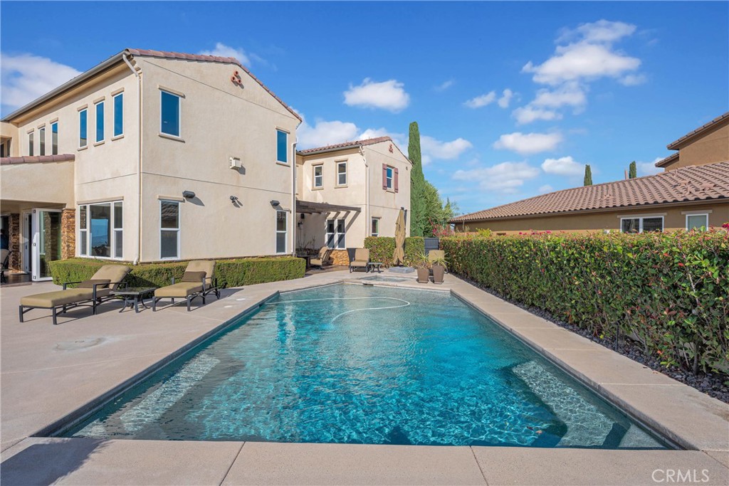 16727 Pienza Court Riverside, CA 92503 - Photo 40 of 41 Mature hedging gives the pool complete privacy