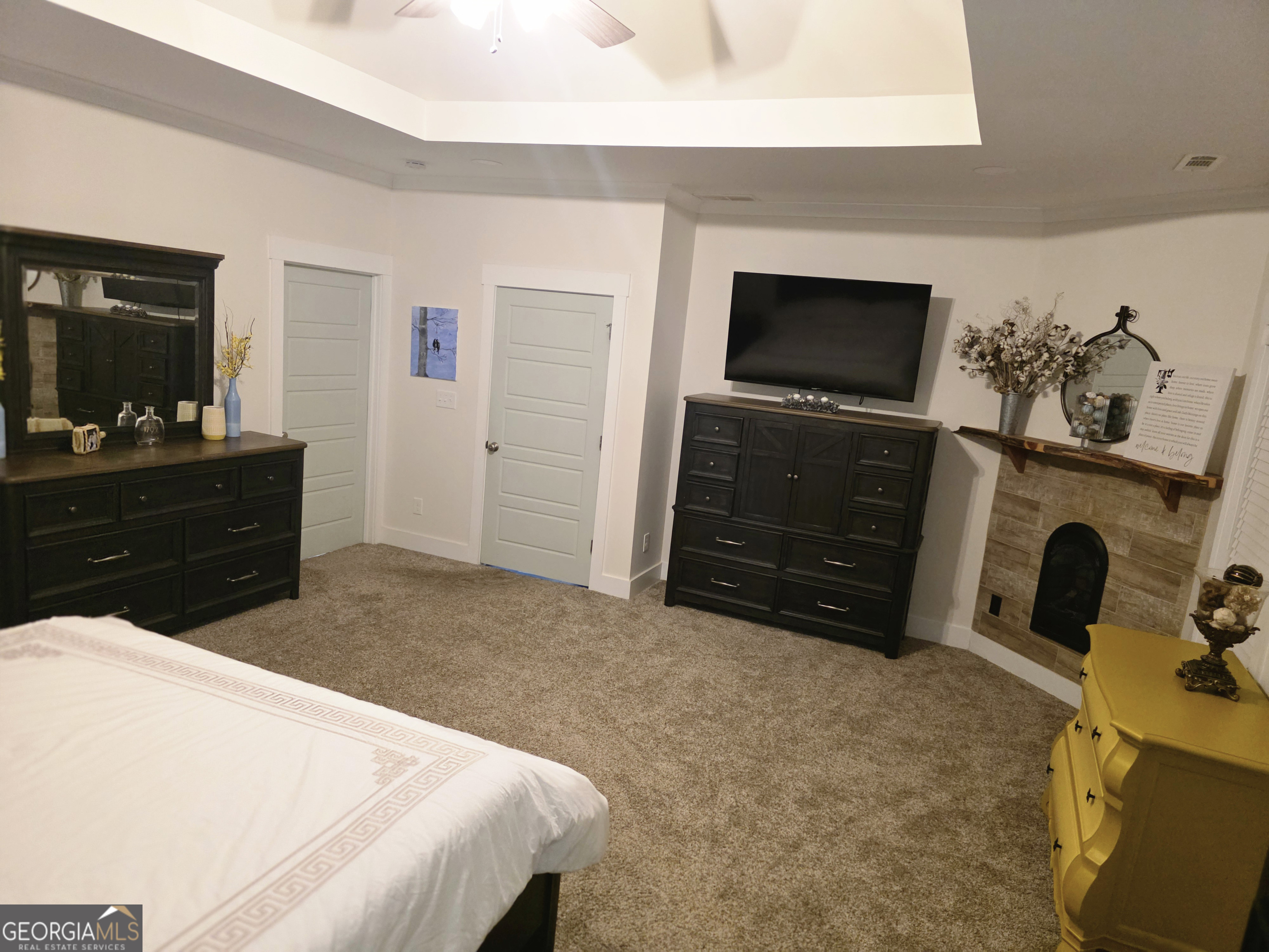 3060 Eatonton Road Madison, GA 30650 - Photo 23 of 65 a bedroom with a bed and a television in it