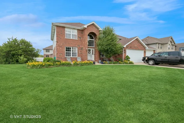 a front view of a house with a yard