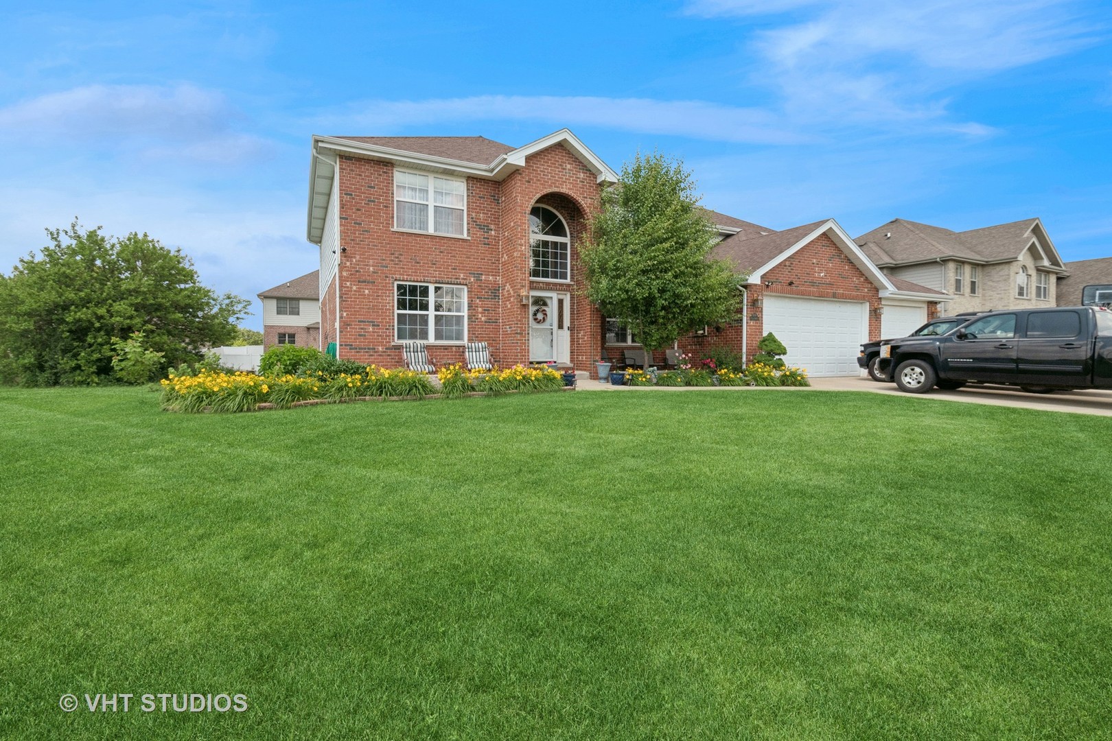 a front view of a house with a yard