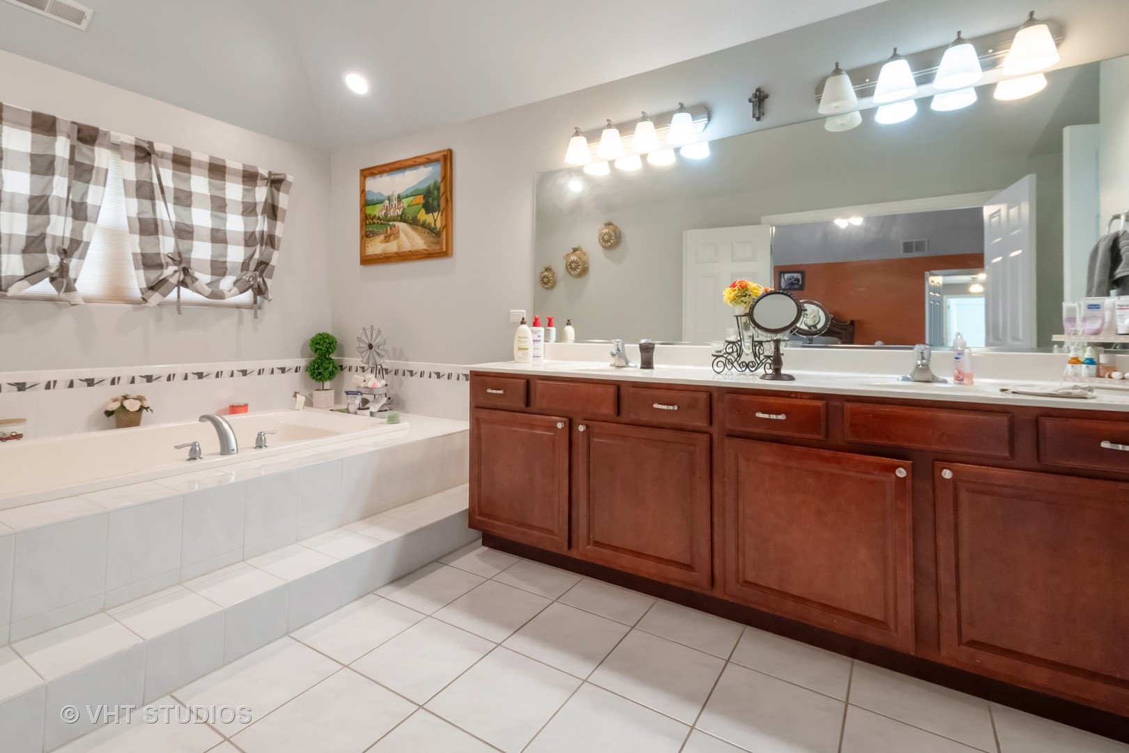 259 Fir Street Beecher, IL 60401 - Photo 18 of 38 a spacious bathroom with a tub sink and mirror
