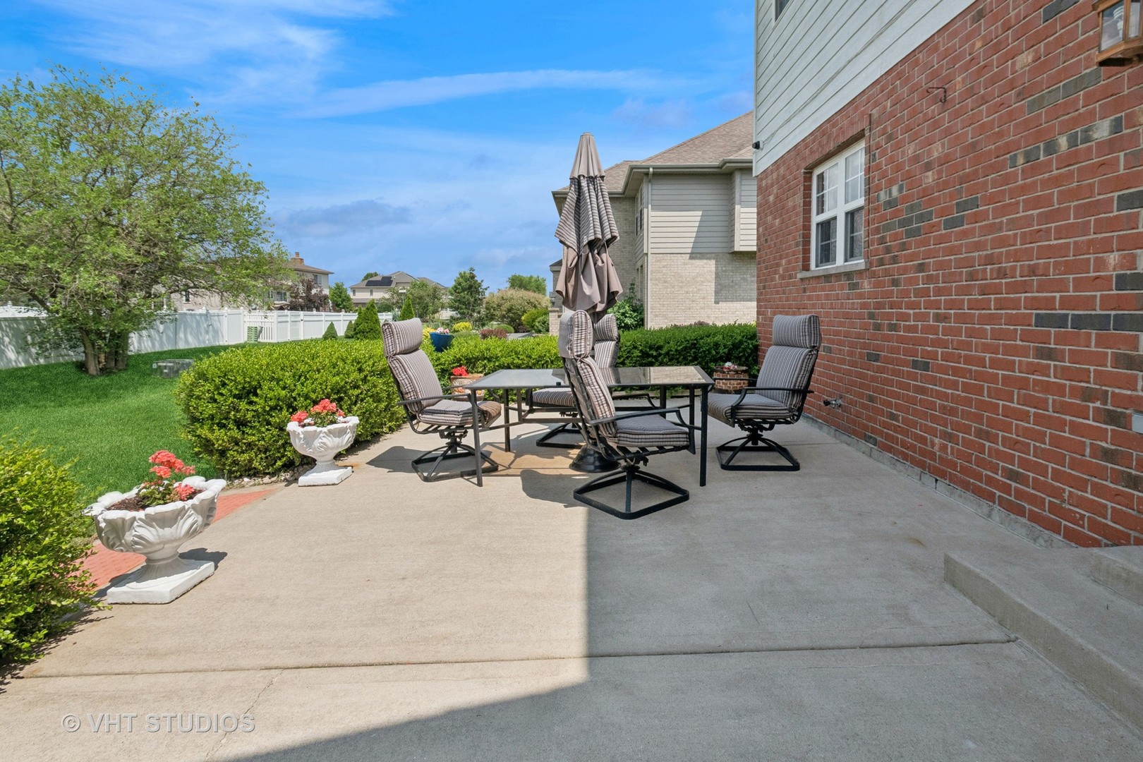 259 Fir Street Beecher, IL 60401 - Photo 32 of 38 a view of a patio with table and chairs and potted plants