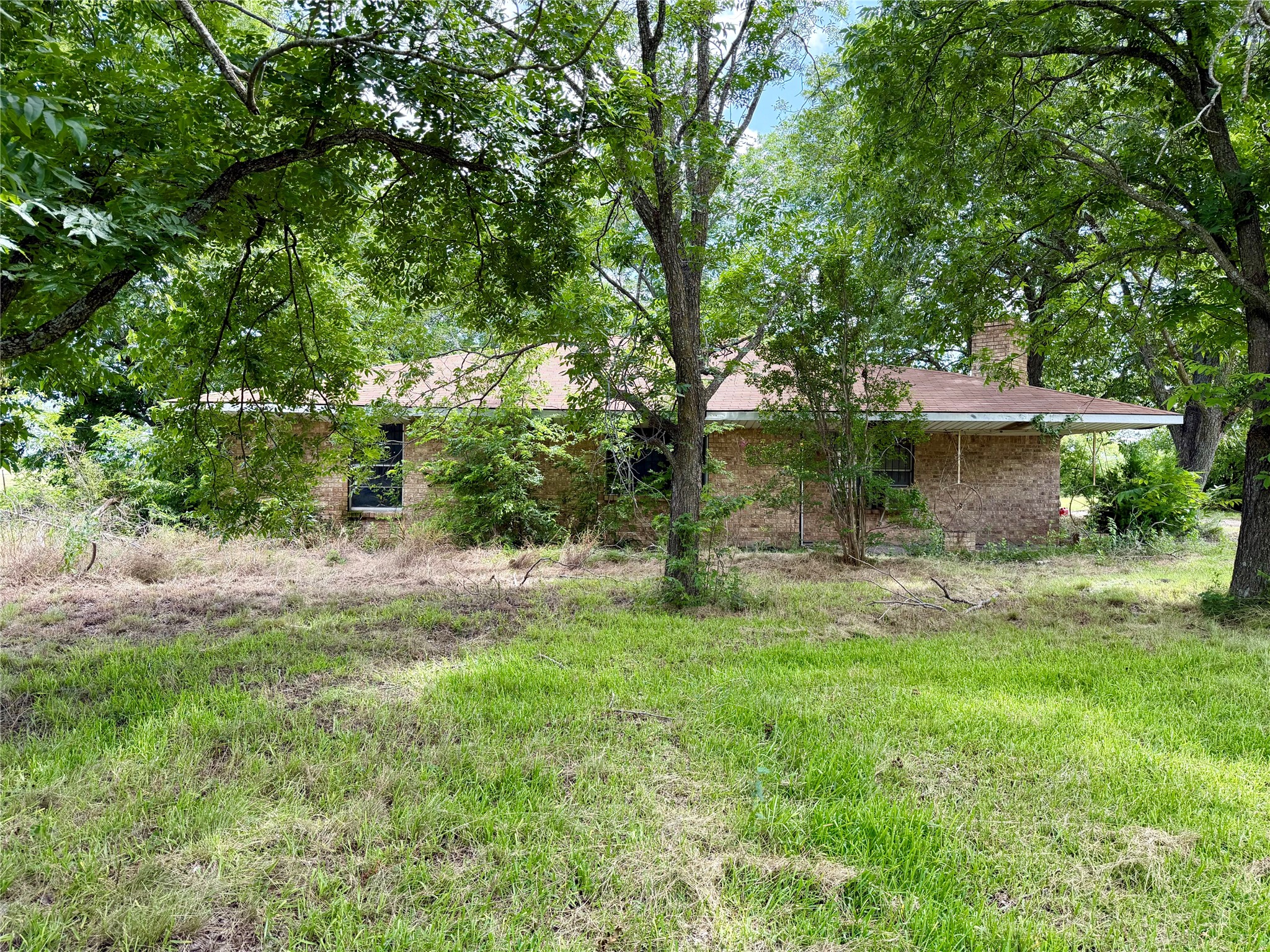 2501 Barnhardt Road Temple, TX 76502 - Photo 23 of 25 Mature trees shade this charming brick residence, creating a private and natural setting.