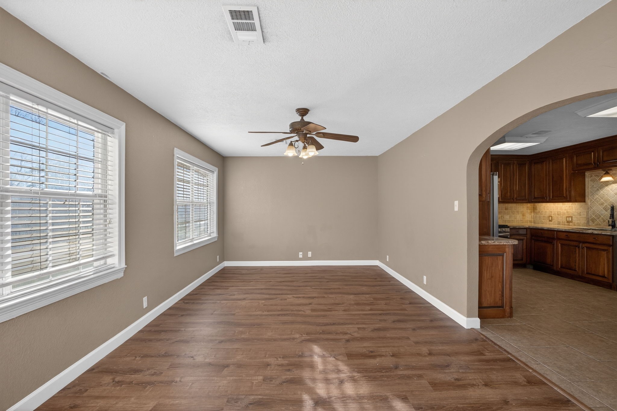 255 Gilmer Street Bridge City, TX 77611 - Photo 16 of 37 a view of a room with a ceiling fan and window