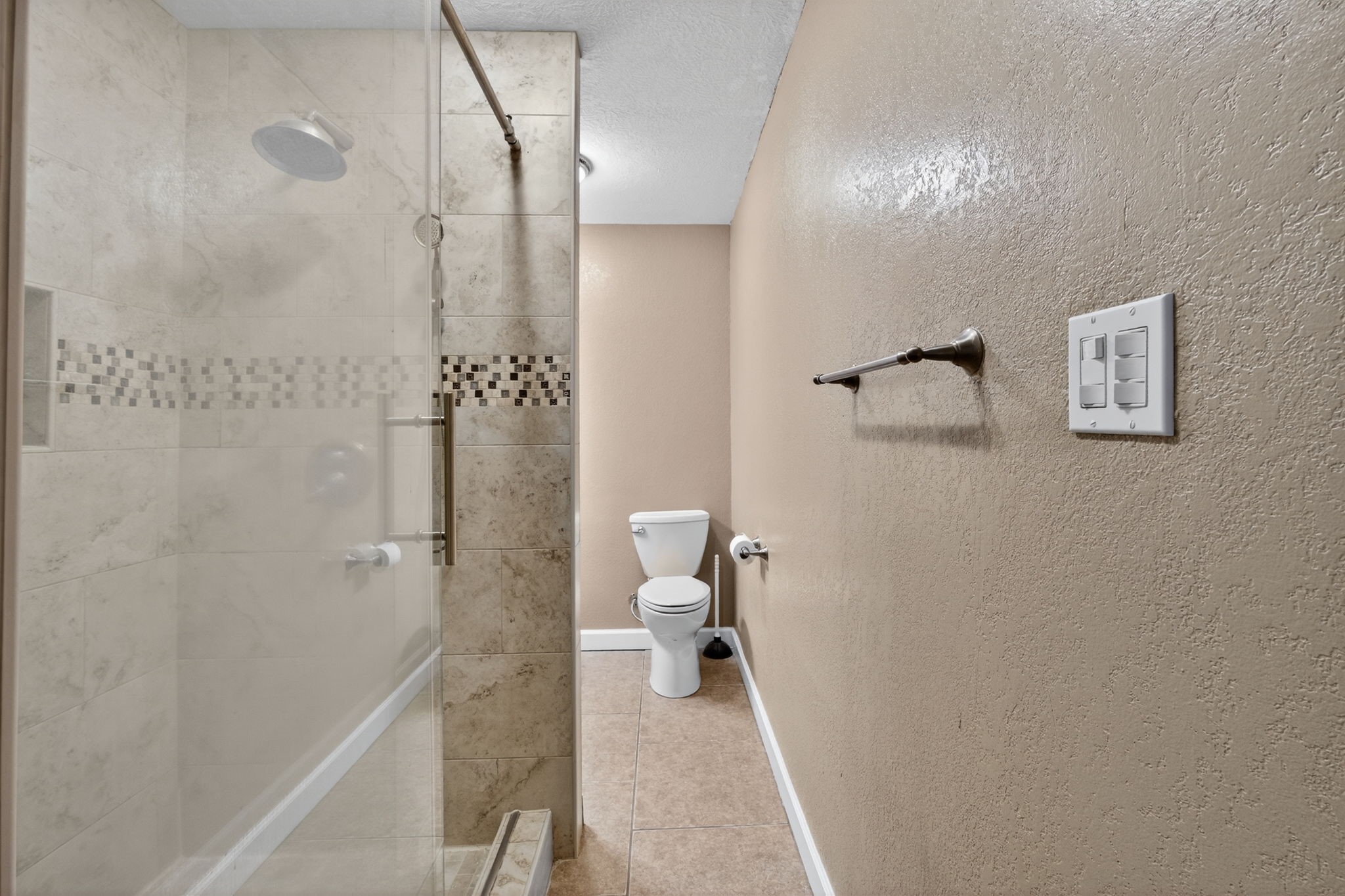 255 Gilmer Street Bridge City, TX 77611 - Photo 21 of 37 a bathroom with a granite countertop shower and a toilet