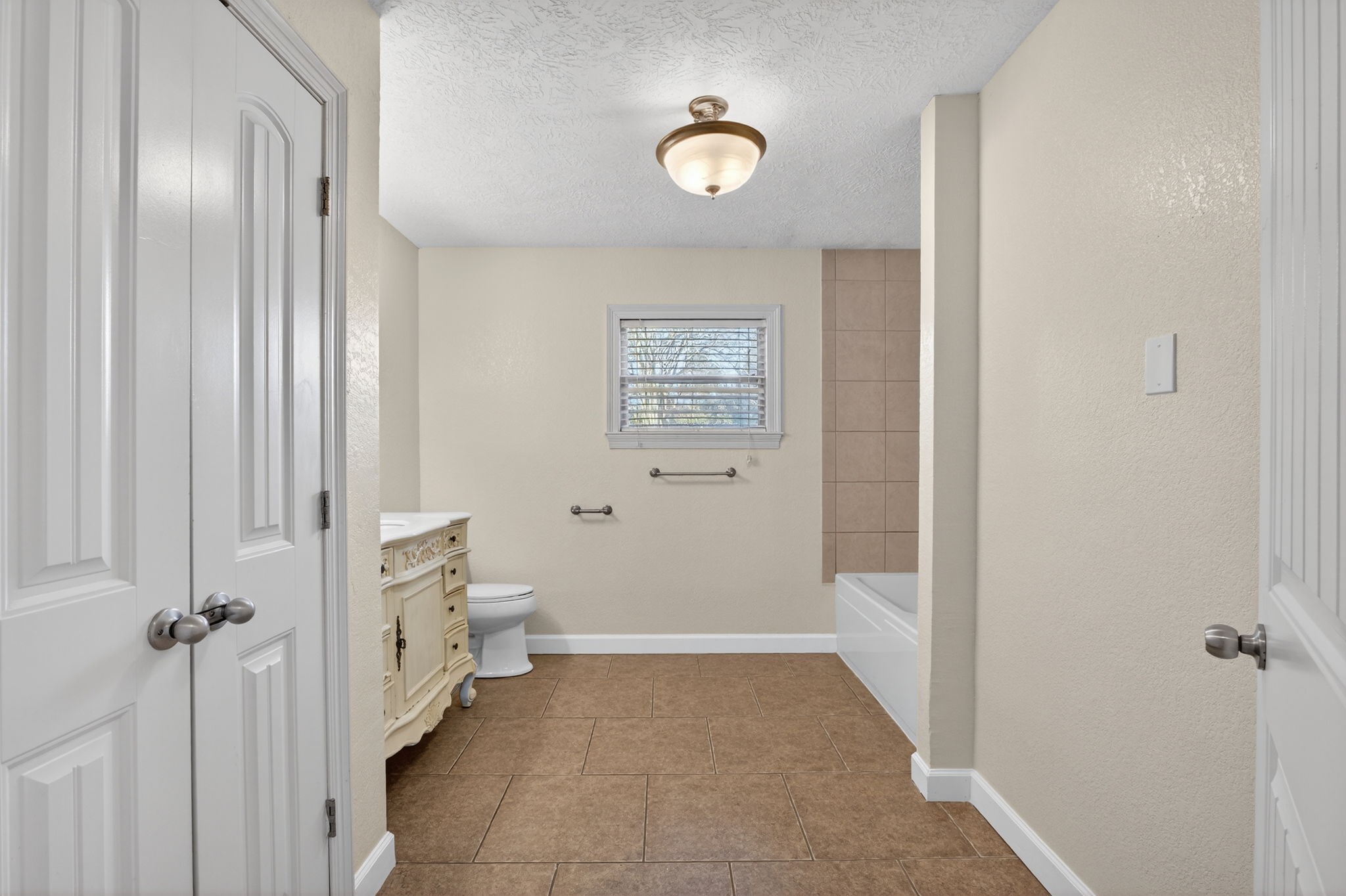 255 Gilmer Street Bridge City, TX 77611 - Photo 26 of 37 a view of a hallway with closet and bathroom
