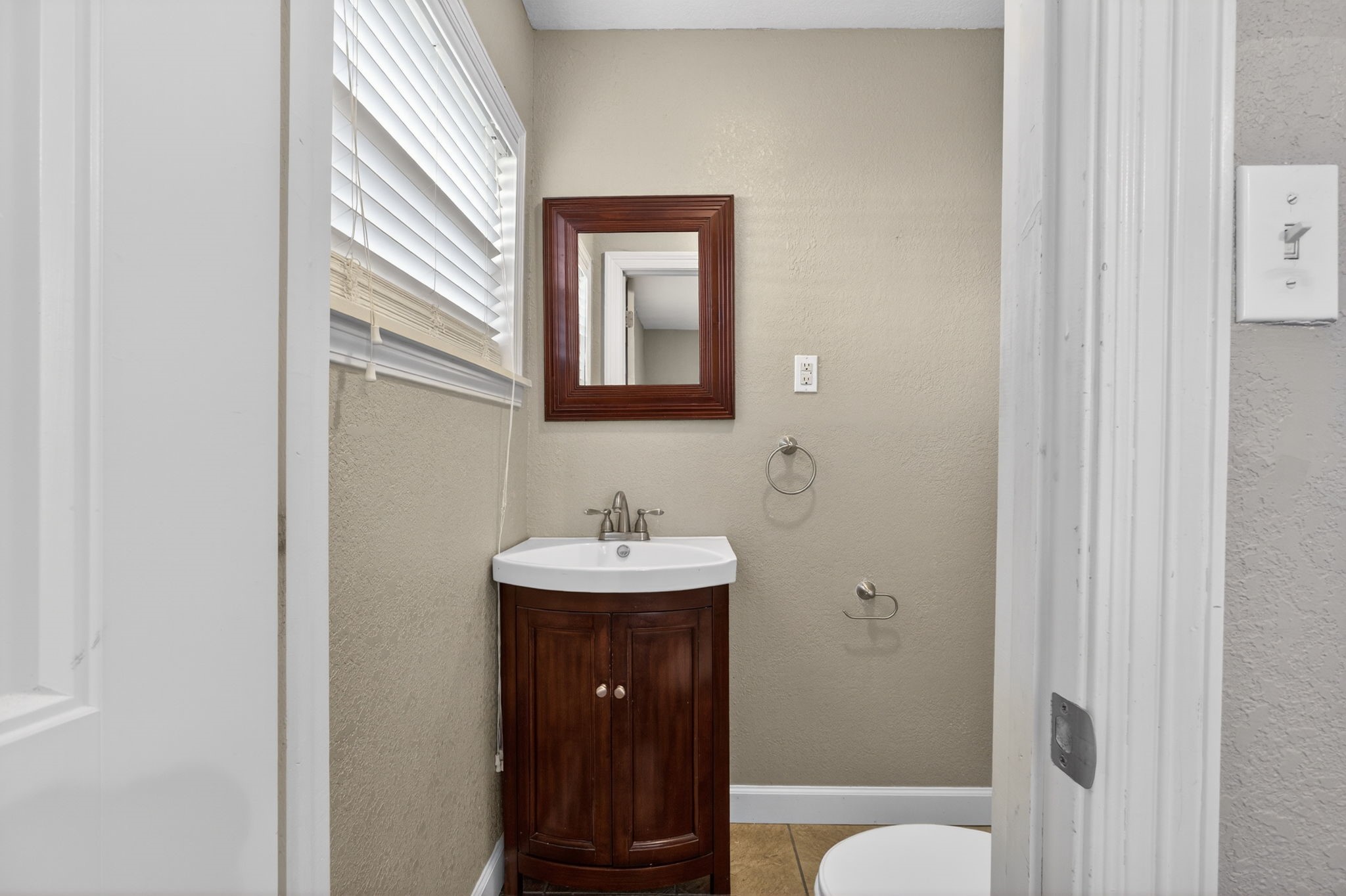 255 Gilmer Street Bridge City, TX 77611 - Photo 32 of 37 a bathroom with a sink a toilet and shower