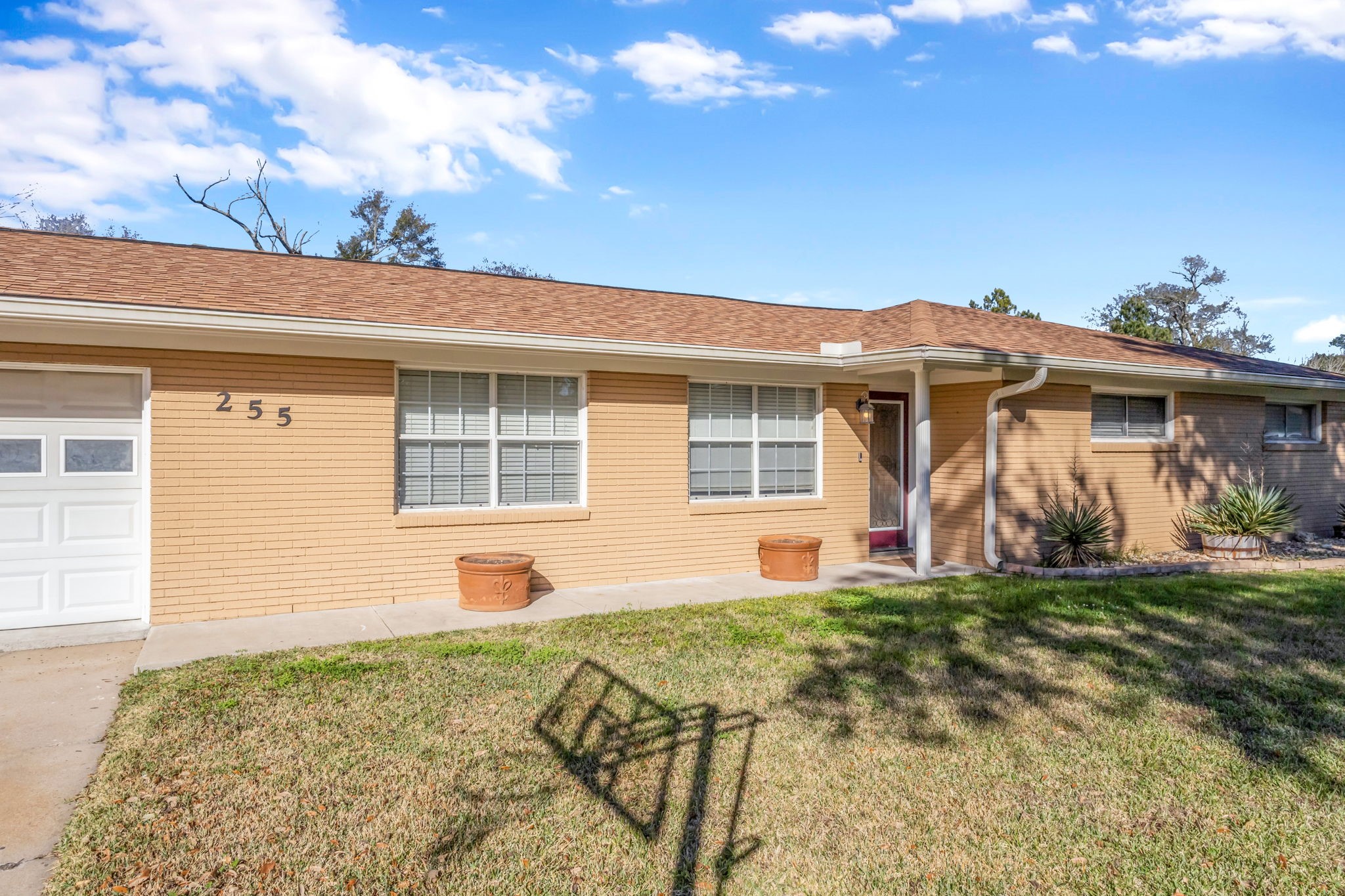 255 Gilmer Street Bridge City, TX 77611 - Photo 5 of 37 a front view of a house with a yard