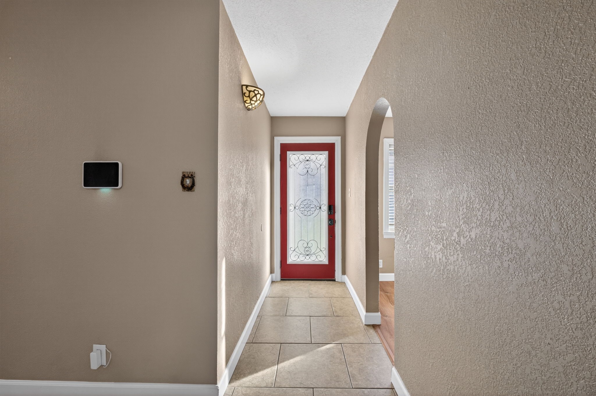 255 Gilmer Street Bridge City, TX 77611 - Photo 7 of 37 a view of a hallway with wooden walls and windows