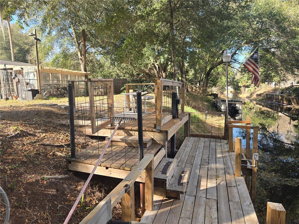 2121 Southeast 170th Avenue Road Silver Springs, FL 34488 - Photo 18 of 23 a view of a balcony with wooden floor