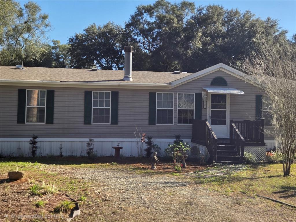 2121 Southeast 170th Avenue Road Silver Springs, FL 34488 - Photo 2 of 23 a front view of a house with a yard