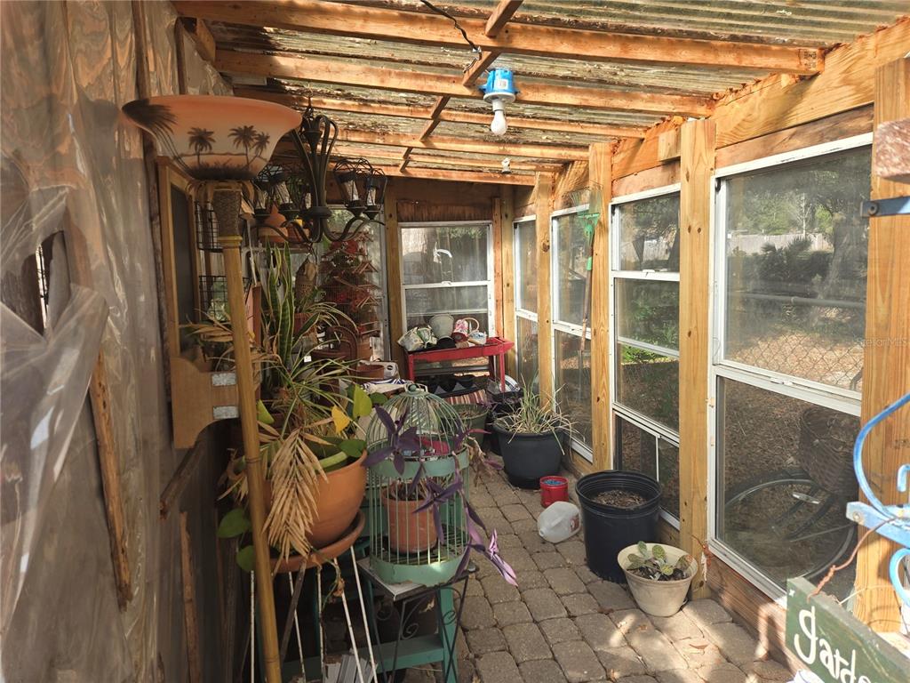2121 Southeast 170th Avenue Road Silver Springs, FL 34488 - Photo 21 of 23 a view of a chairs and table in a patio