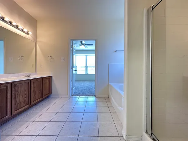a bathroom with a mirror a sink and a mirror