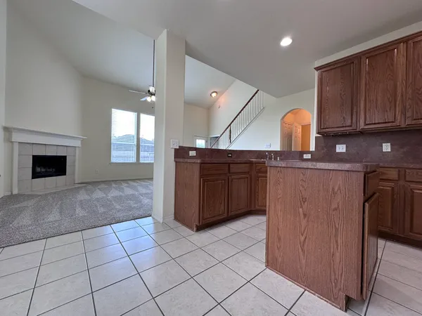 a kitchen with stainless steel appliances a sink and cabinets