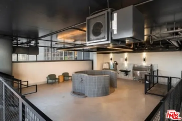 a kitchen with stainless steel appliances granite countertop a sink and a stove