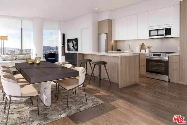 a kitchen with a table chairs stove and cabinets