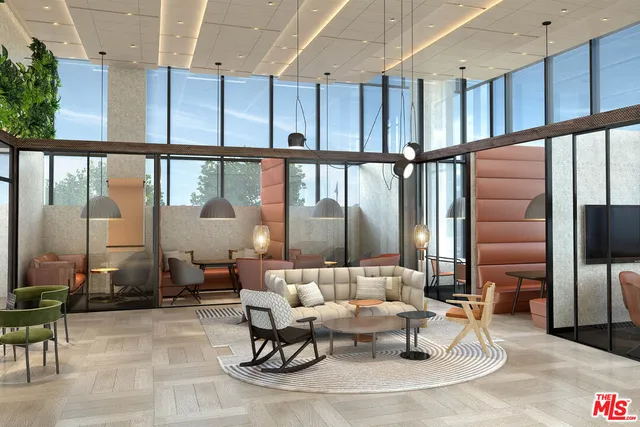 a living room with couches a coffee table and chairs with wooden floor