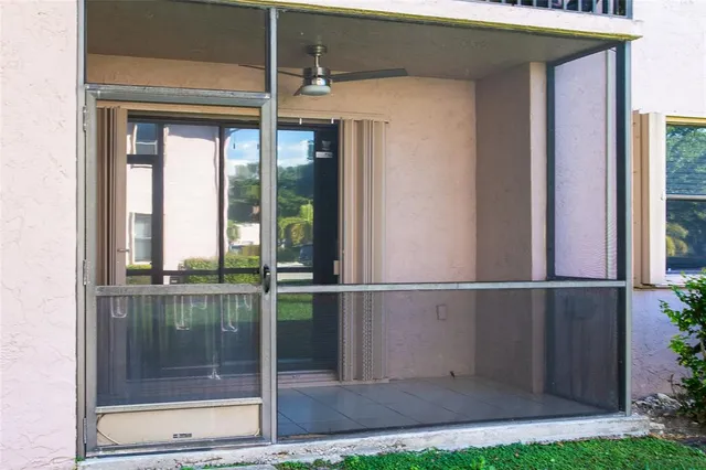 a view of a house with a backyard and porch
