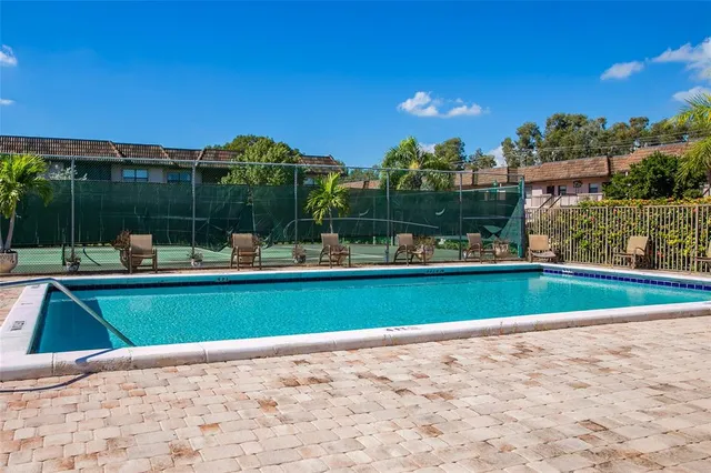 a view of a swimming pool and a yard