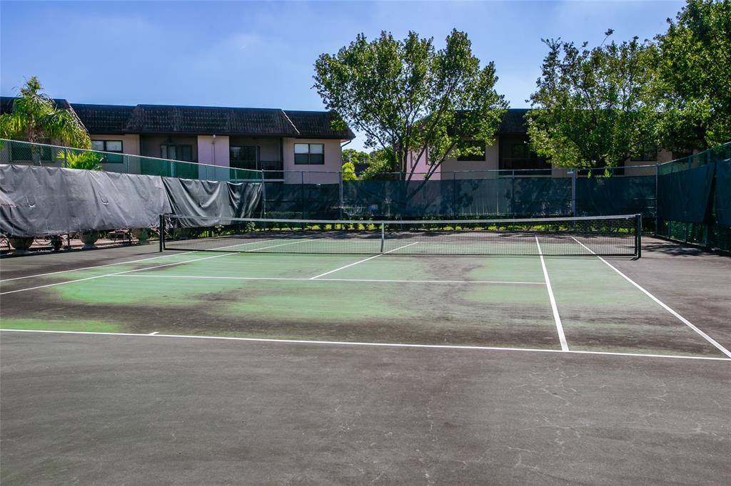 10557 Northwest 10th Street, Unit 101 Pembroke Pines, FL 33026 - Photo 18 of 19 a view of a tennis court