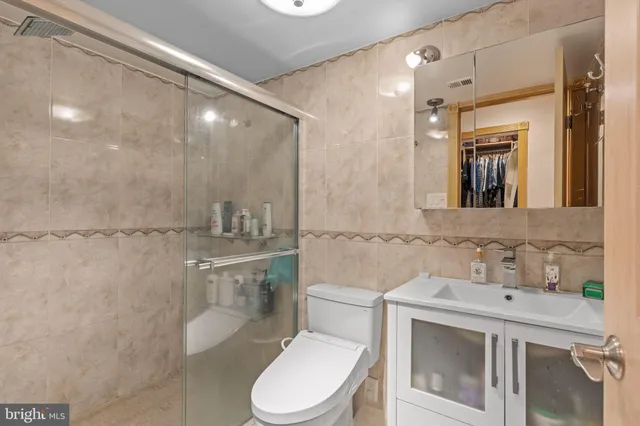 a view of a livingroom with workspace and a window