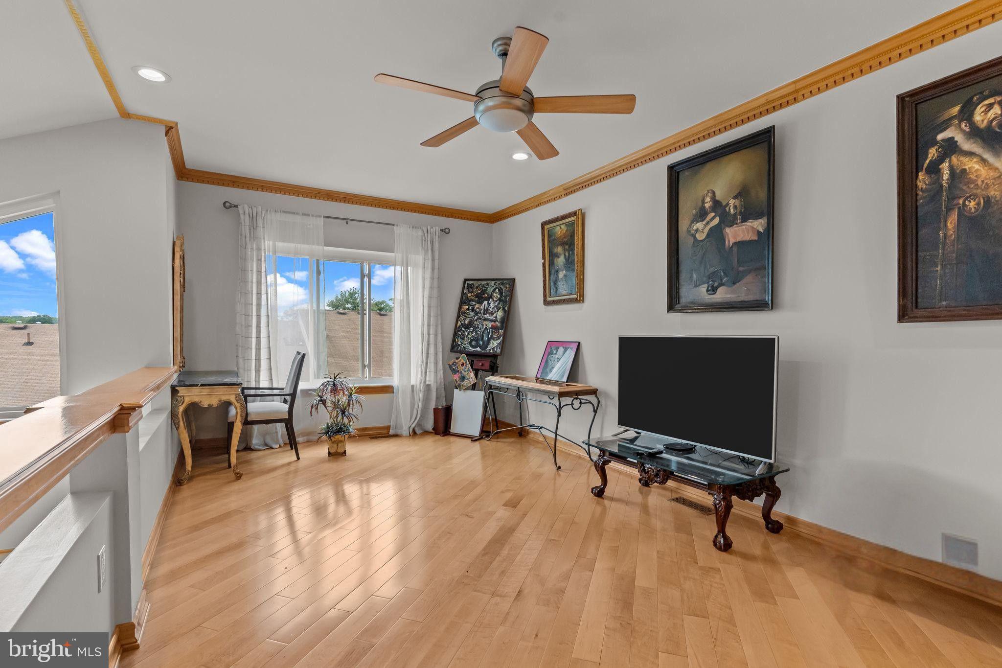 75 Bonnie Gellman Court, Unit D75 Philadelphia, PA 19114 - Photo 18 of 37 a view of a livingroom with workspace and a window