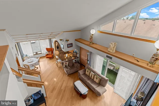 a bathroom with a granite countertop sink a toilet a mirror and shower