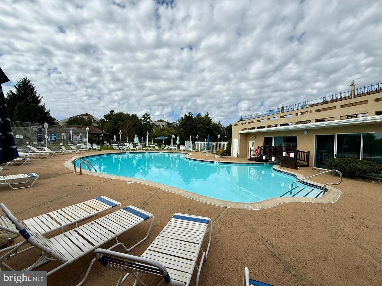 75 Bonnie Gellman Court, Unit D75 Philadelphia, PA 19114 - Photo 26 of 37 a view of a house with swimming pool and sitting area