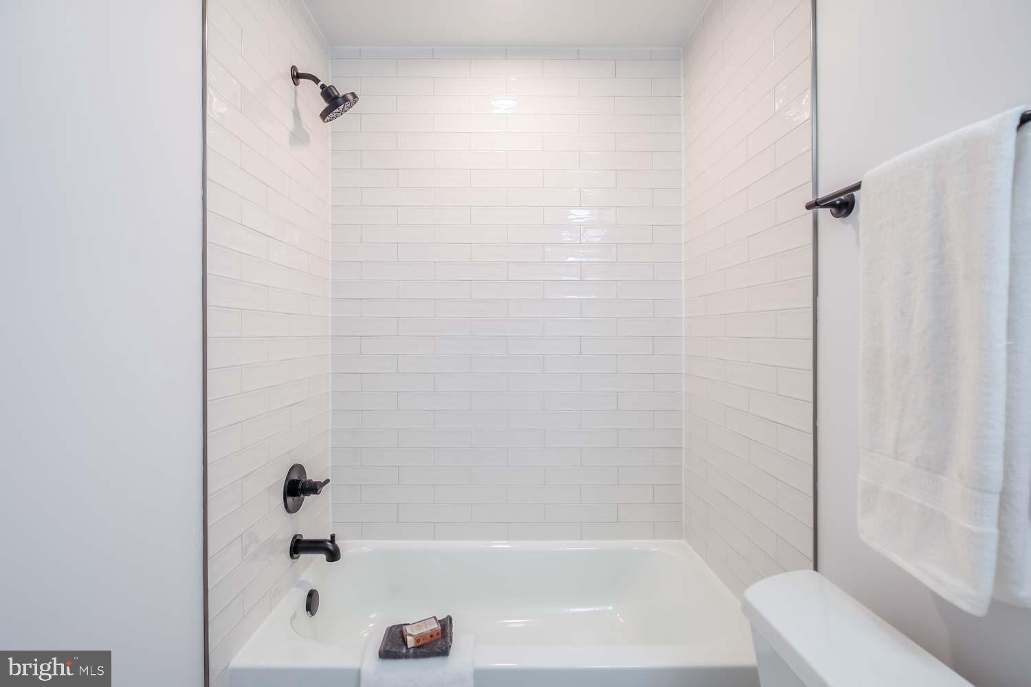 2601 30th Street Northeast, Unit 11 Washington, DC 20018 - Photo 17 of 32 a bathroom with a bathtub