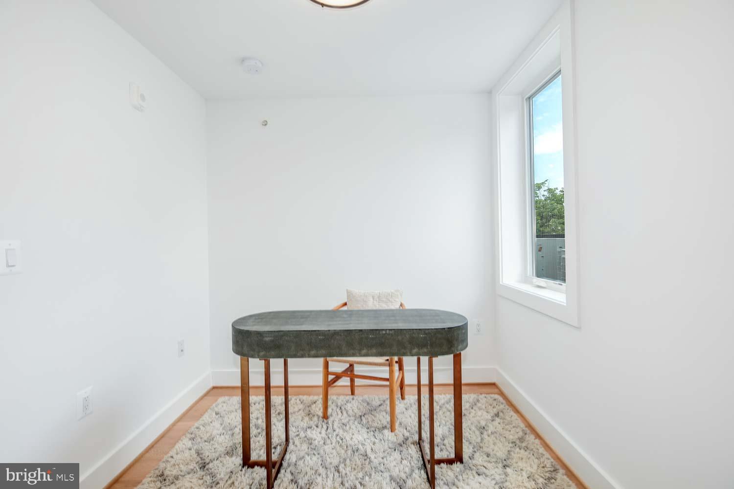 2601 30th Street Northeast, Unit 11 Washington, DC 20018 - Photo 18 of 32 a view of a workspace with furniture