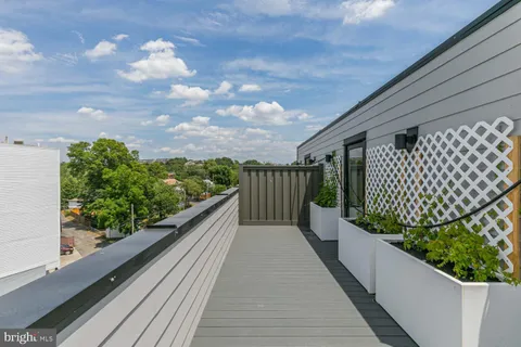a view of balcony with wooden floor