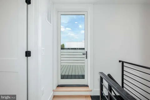 a view of a hallway with washer and dryer