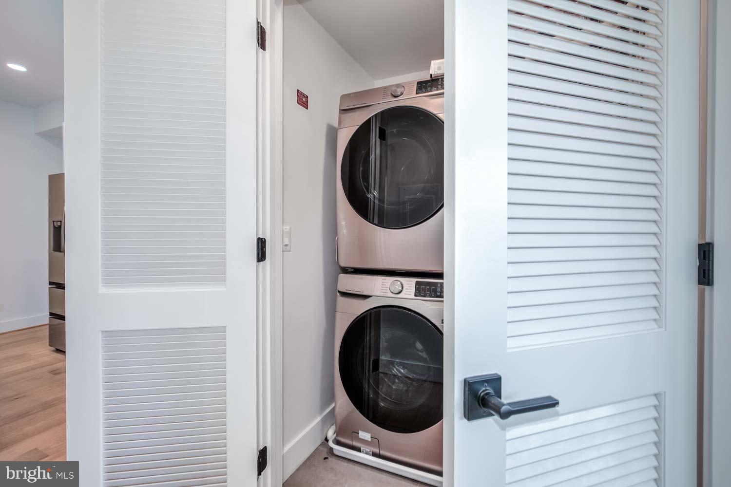 2601 30th Street Northeast, Unit 11 Washington, DC 20018 - Photo 29 of 32 a view of a hallway with washer and dryer
