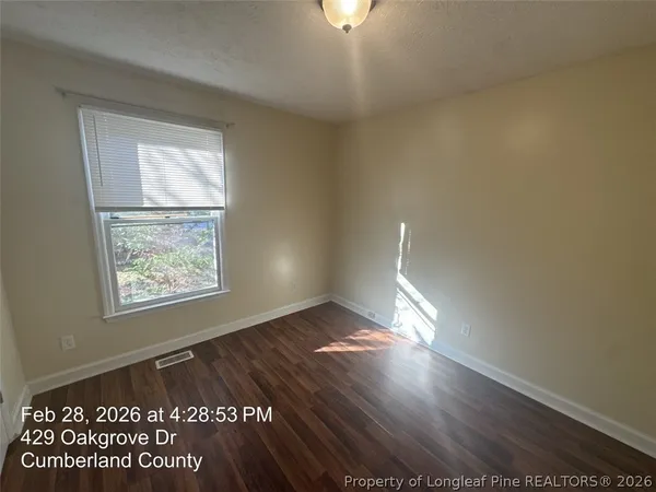 a view of an empty room and window