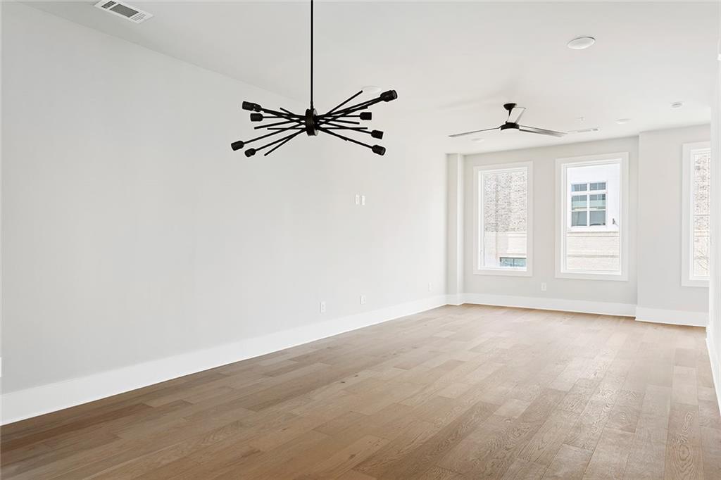 7230 Summit Place Alpharetta, GA 30009 - Photo 10 of 37 an empty room with windows and fan